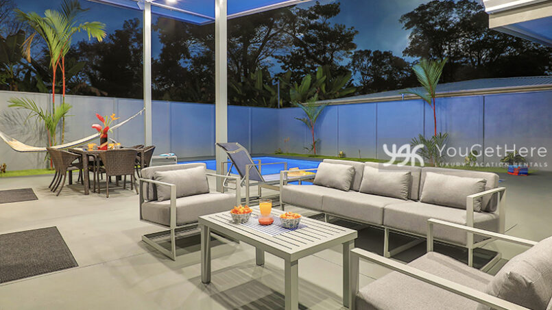 Bella Vita pool deck with two oversized chairs and comfortable sofa.