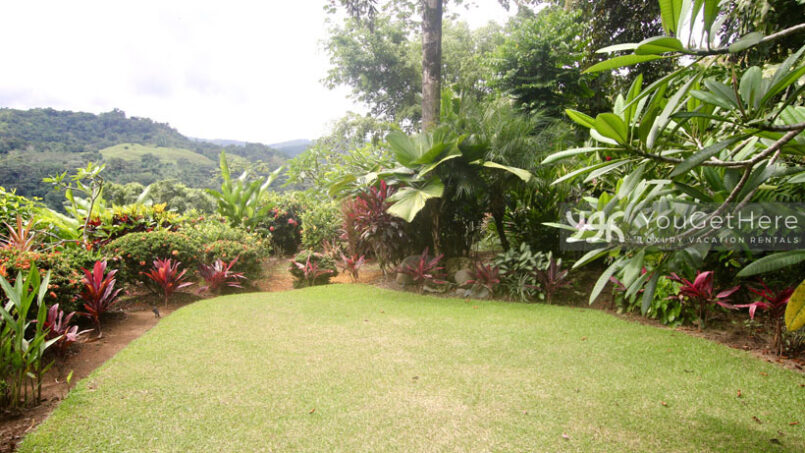 Grass area surrounded by tropical landscaping at Villa Koora Costa Rica.