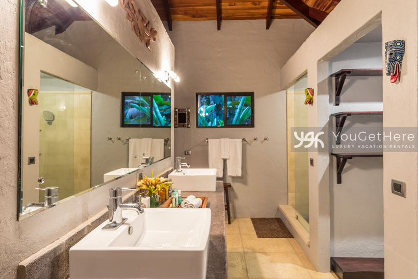 Villa Koora large bathroom with dual sinks and plenty of counter space.