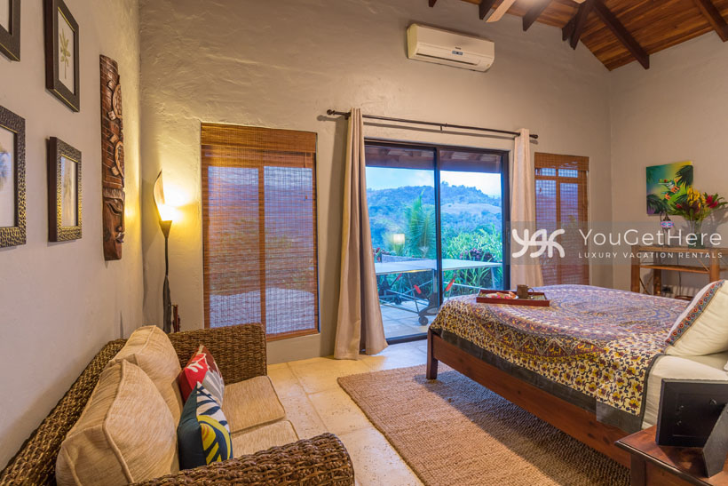 Villa Koora guest bedroom with sliding door onto patio.