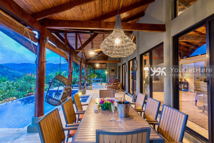 Huge outdoor dining area at Villa Koora with table that seats eight.