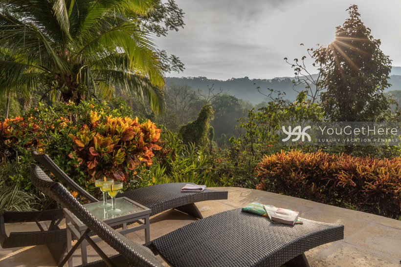 Beautifully landscaped area around Villa Koora patio with lounge chairs facing the view.