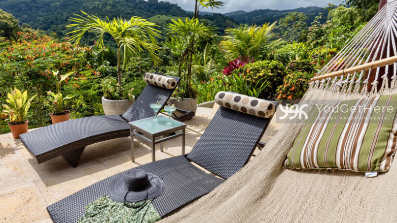 Tons of comfortable seating options with views surround the pool at Villa Koora Holiday rental in Costa Rica.