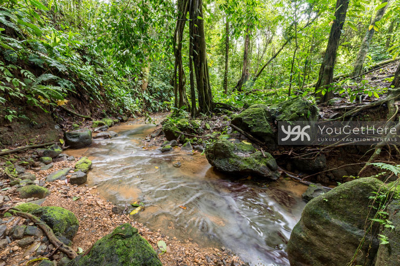 Relaxing creek runs nearby to Villa Koora Costa Rica.