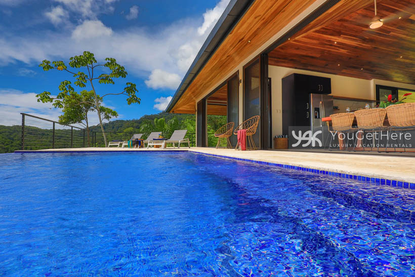 Villa Dalu large refreshing pool with stunning ocean and jungle views.