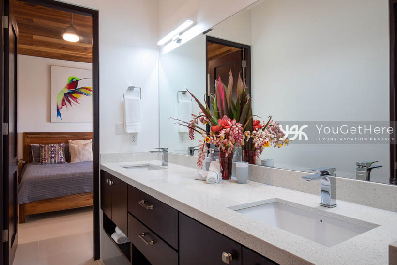 Villa Dalu guest bath off of bedroom with modern clean design.