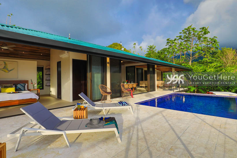 Outdoor pool deck view of Villa Dalu and primary master off of deck.