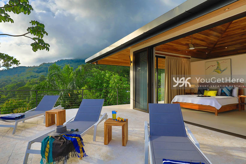 Primary bedroom and outdoor patio at Villa Dalu Luxury Rental.