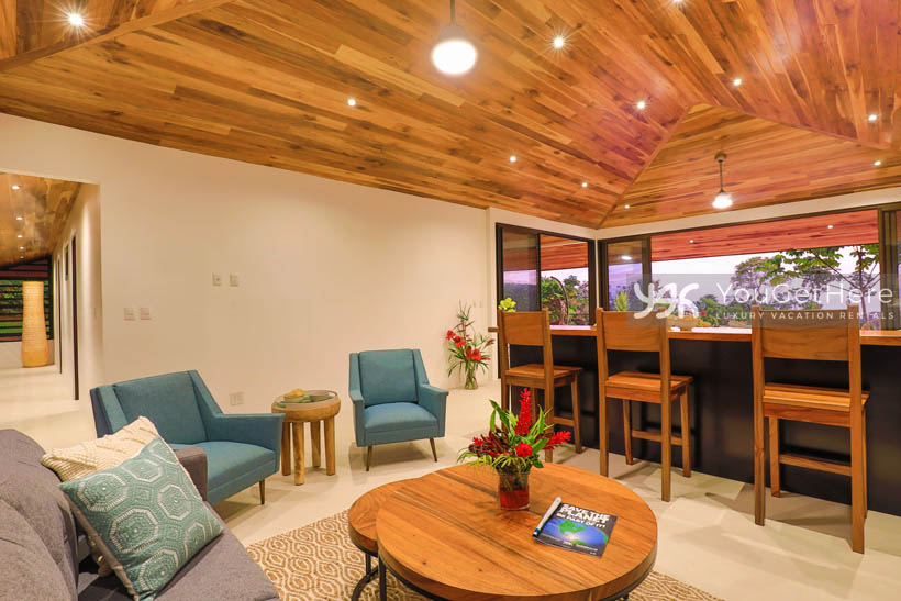 Villa Dalu living area featuring two comfortable sofas, two chairs and a wood coffee table.