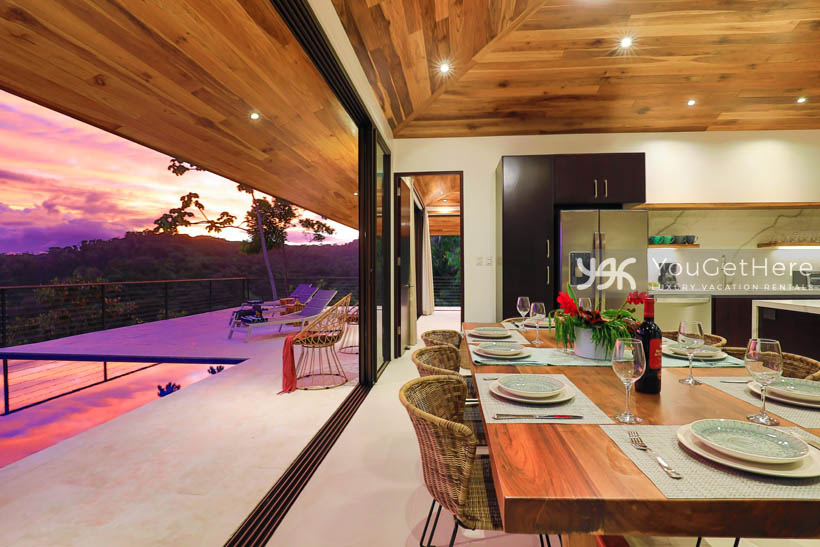 Villa Dalu dining area and kitchen with huge views of the Costa Rican jungle in every direction.
