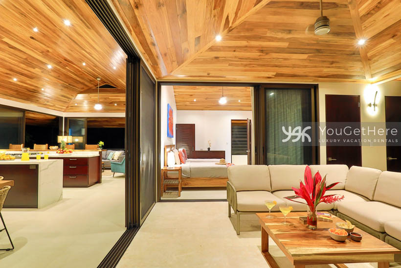 Indoor outdoor living design with huge disappearing slider doors to blend living room with patio.