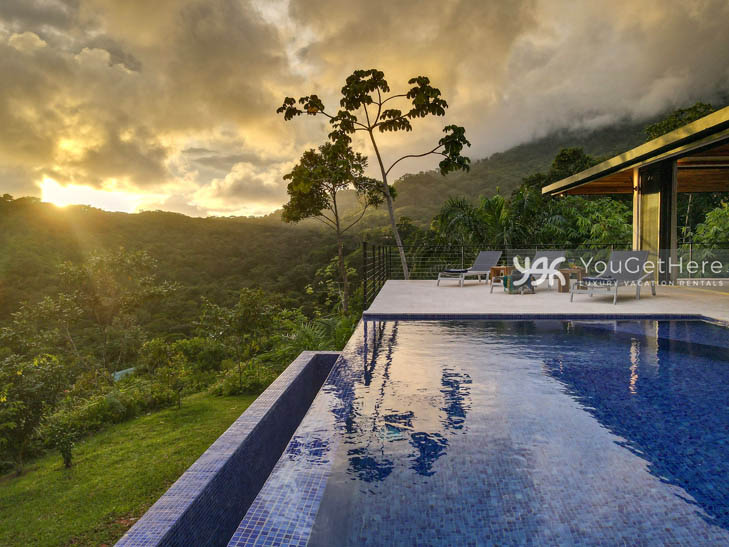 Beautiful sunset over the jungle canopy from the pool deck at Villa Dalu Costa Rica.