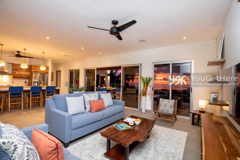 Tulu Azul Costa Rica comfortable living space off of modern kitchen with bar stool seating and ocean views.