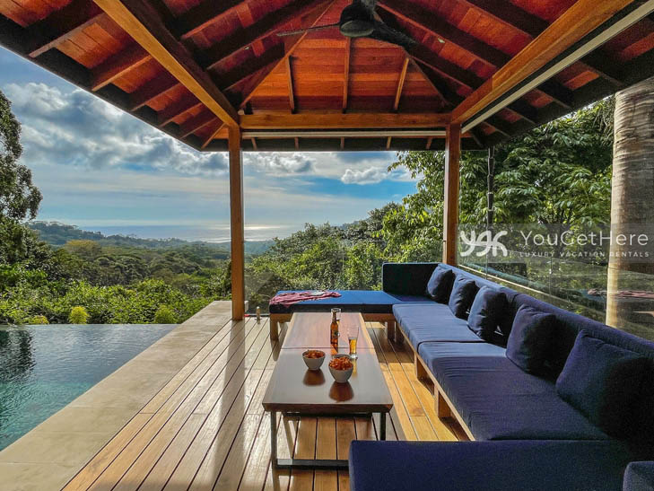 Tulu Azul Costa Rica Ocean view outdoor deck with covered ceiling and fan and massive comfortable sofa right off the pool deck.