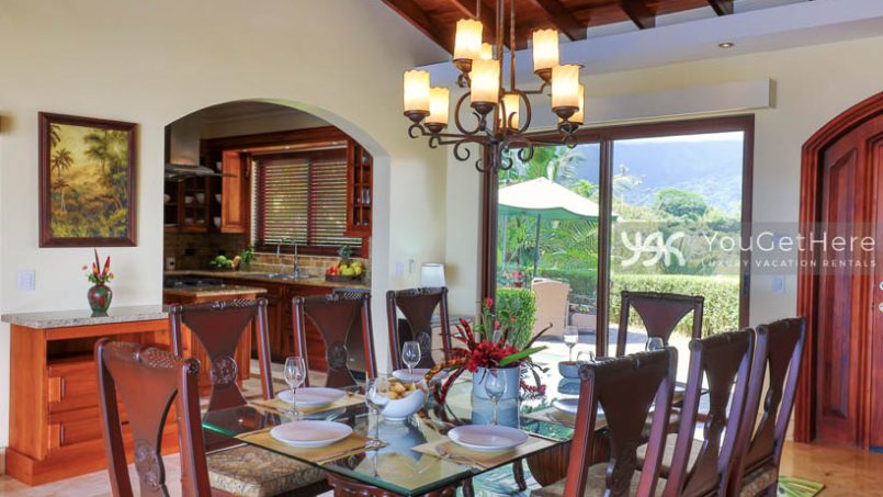 Vista Encanto Costa Rica Dining Table set for eight with lovely chandelier overhead.
