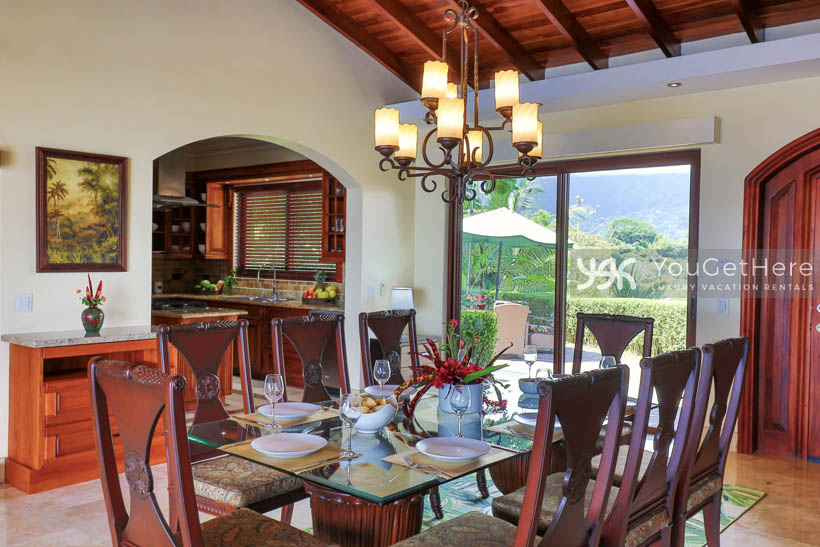 Vista Encanto Costa Rica Dining Table set for eight with lovely chandelier overhead.
