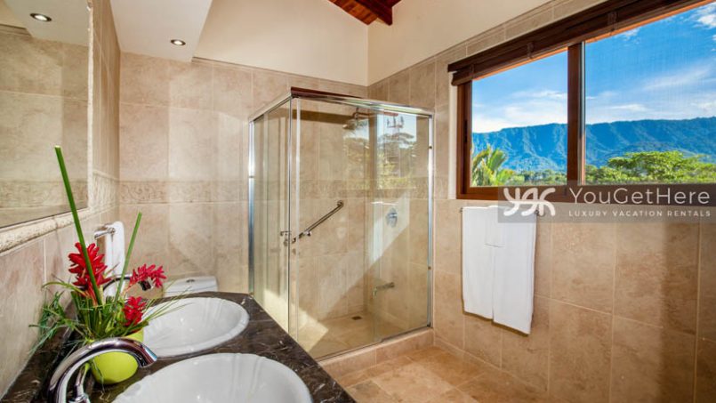 Vista Encanto Costa Rica guest bathroom with shower and mountain views out window.