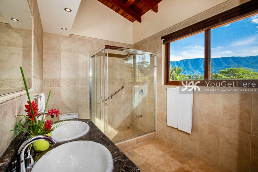 Vista Encanto Costa Rica guest bathroom with shower and mountain views out window.