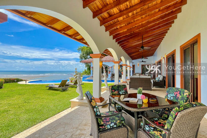 Huge patio running length of home with tons of comfortable seating and full ocean views.