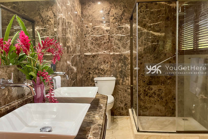 Vista Encanto Costa Rica modern bathroom with beautifully wall to ceiling tiling.