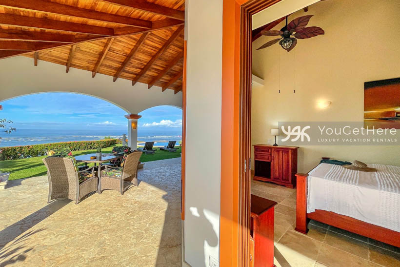 Ocean view backyard patio at Vista Encanto Costa Rica with comfortable outdoor dining table.