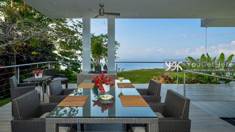 Outdoor comfortable gray dining chairs for four at Meridian House Costa Rica.