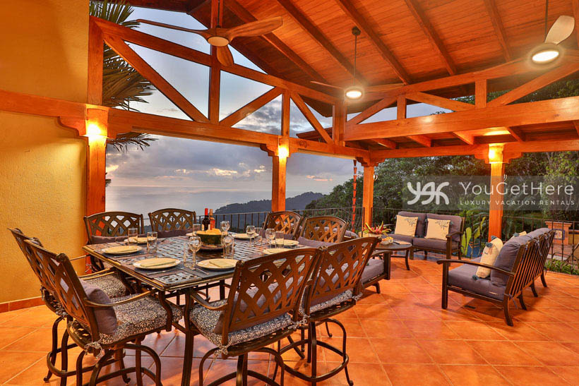 Villa Divertida luxury rental outdoor dining with sunset view.
