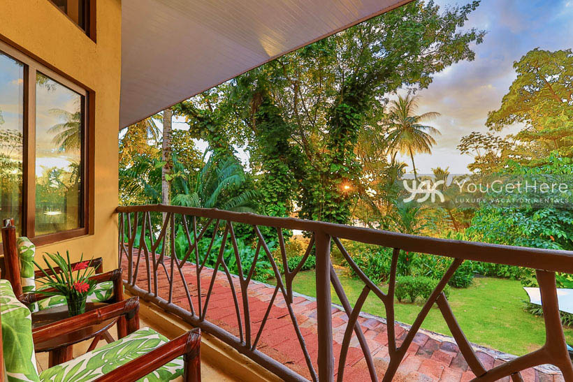 View of the sun setting over the pacific from the second floor balcony chairs at Caballitos del Mar Sur.