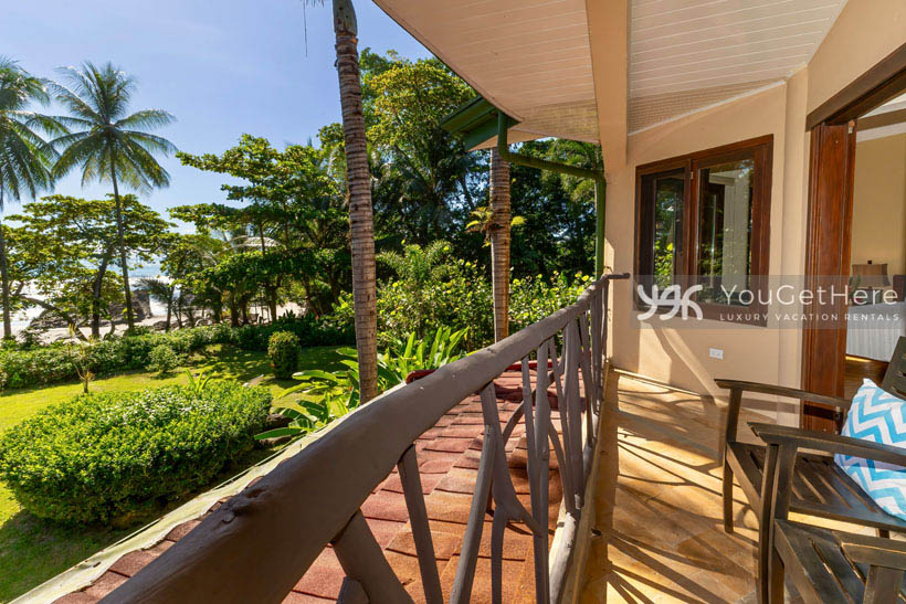 Caballitos del Mar view of sandy beach at ocean front home from balcony.