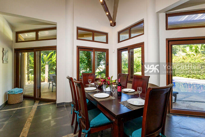 Unique overhead bamboo lighting over Caballitos del Mar Sur dining table.
