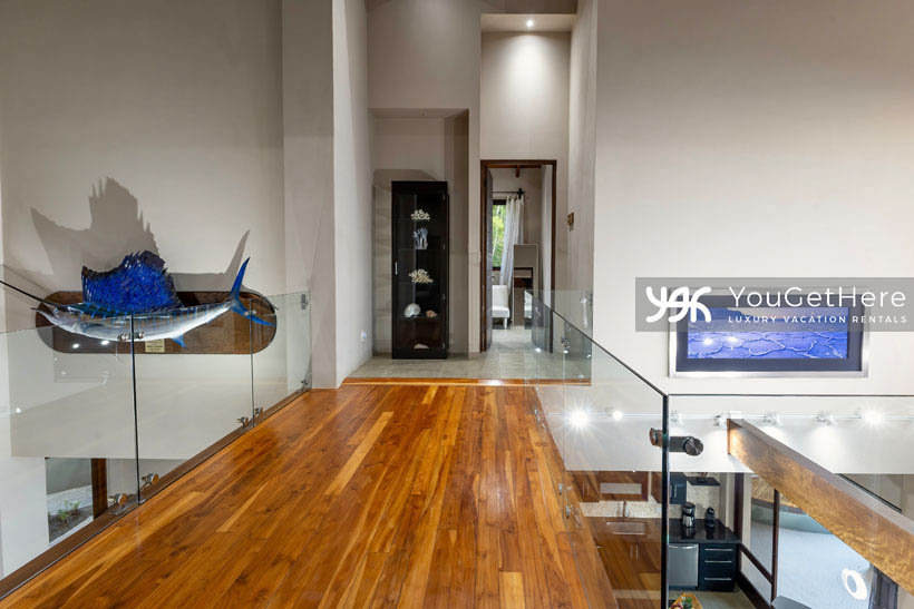 Jade House Costa Rica second floor walkway to guest suites that looks over open space living areas below.