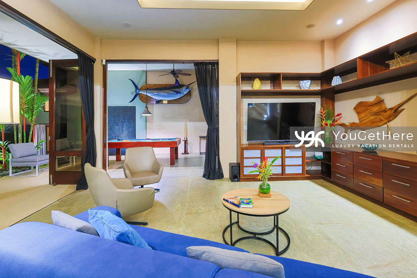 Jade House Costa Rica amazing billiards and lounge with beautiful tropical themed decor, local wood cabinetry and comfortable couch and chairs.