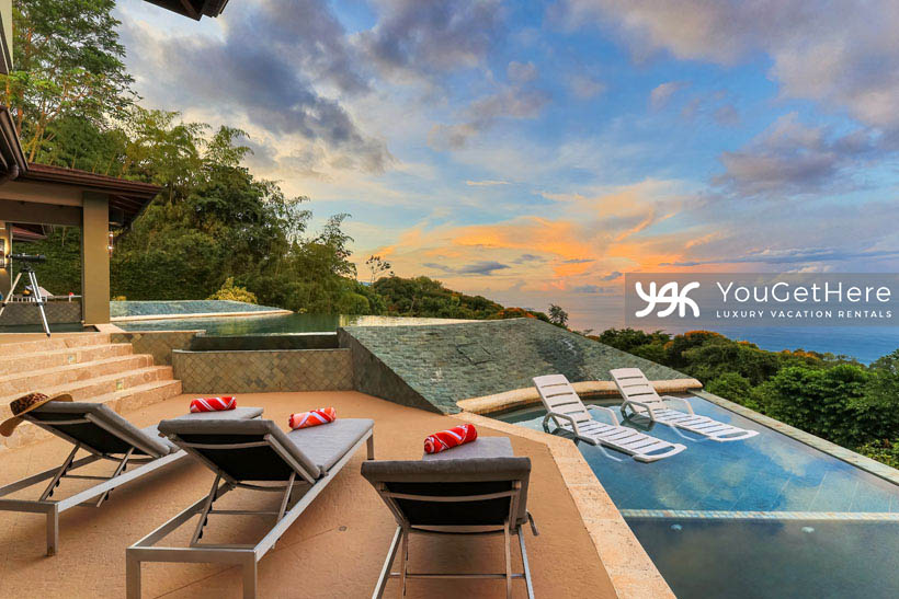 Jade House Costa Rica primary suite pool and deck featuring submerge lounge chairs and incredible ocean-views over jungle canopy.