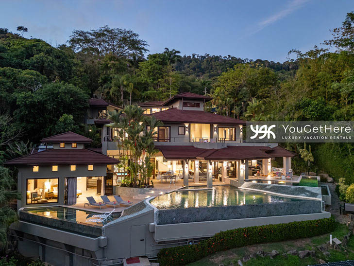 Aerial drone view of the entire Jade House property featuring three separate pools, huge outdoor kitchen, bar and patio area.
