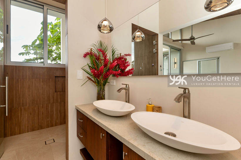 Costa Rica vacation villa featuring beautiful interior design throughout and unique custom fixtures in spacious bathroom.
