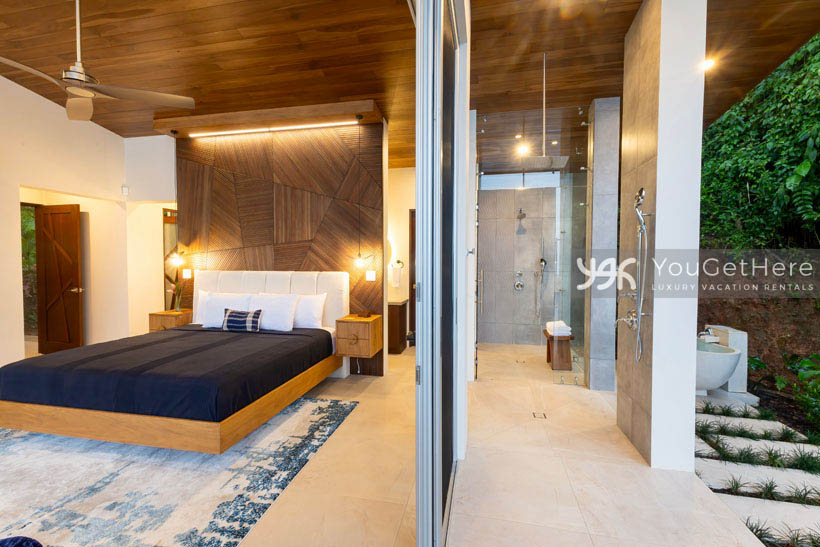 Costa Rica vacation villa featuring soaking tub in garden settings and outdoor rain fall shower on master suite patio.
