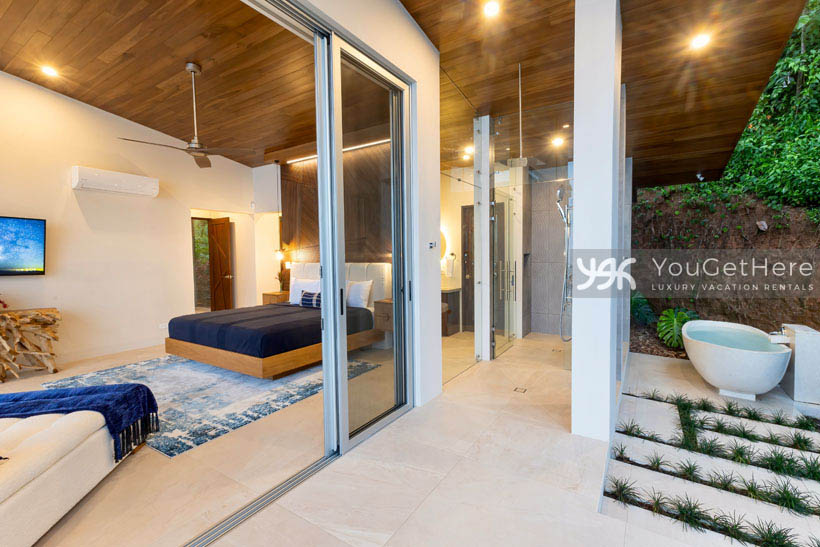Luxurious vacation villa in Costa Rica featuring outdoor soaking tub and shower on primary master suite veranda.