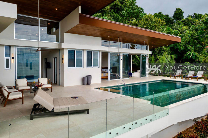 Costa Rica vacation villa with ocean view infinity pool and beautifully furnished pool deck.